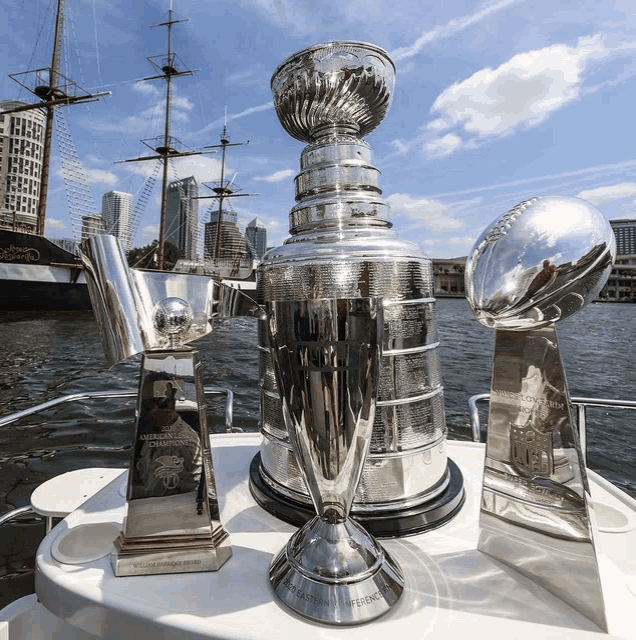 several trophies on a boat one of which says american champions