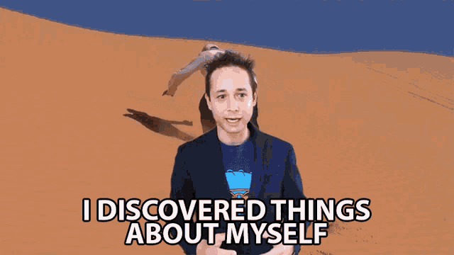 a man in a suit says " i discovered things about myself " in front of a sand dune