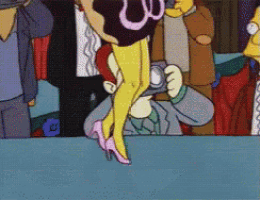 a man is taking a picture of a woman 's legs with a camera