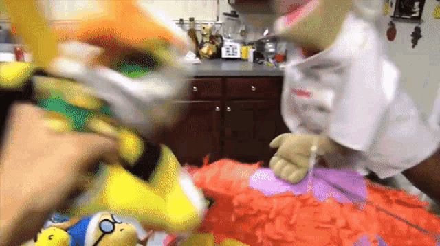 a person is holding a stuffed animal while another person holds another stuffed animal