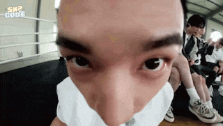 a close up of a man 's face with a bandage on his nose and mouth .