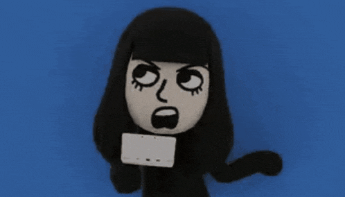 a stuffed animal with long black hair is holding a white tablet