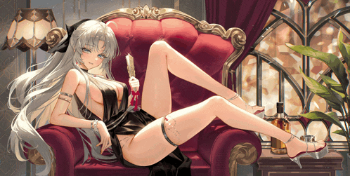 a woman in a black dress is laying on a chair