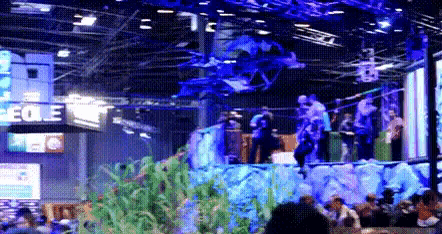 a blurry picture of a convention with a sign that says eoe