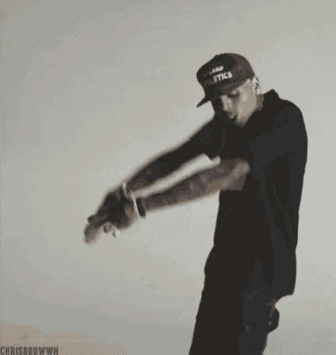 chris brown is wearing a hat that says athletics