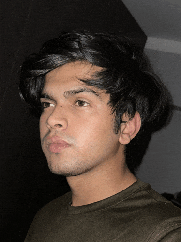 a close up of a young man 's face with his eyes closed