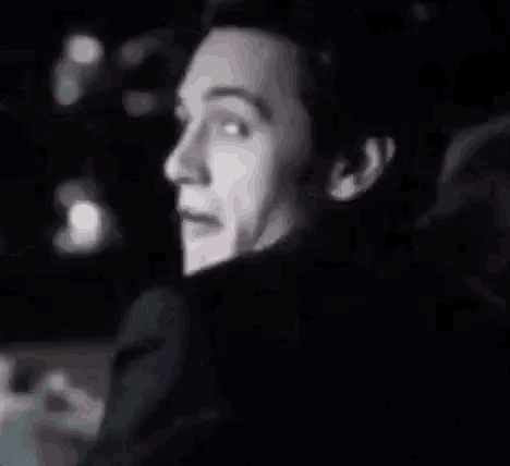 a man is smiling and the words manda nudes are behind him