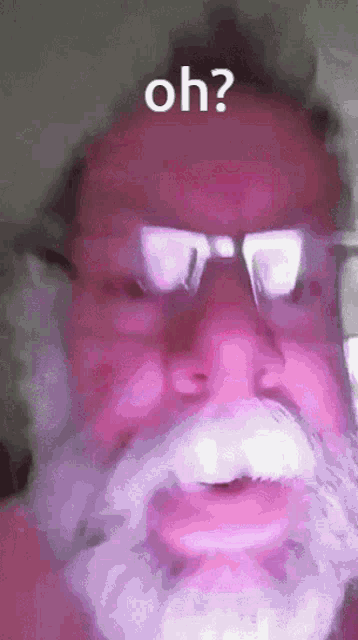 a man with glasses and a white beard is asking the question oh