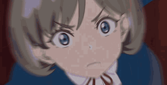 a close up of a girl 's face with a very angry look on her face