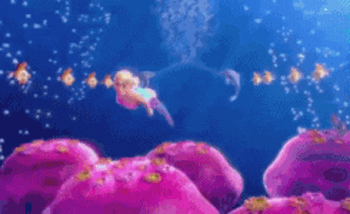 a mermaid is swimming in the ocean on top of a pink rock .