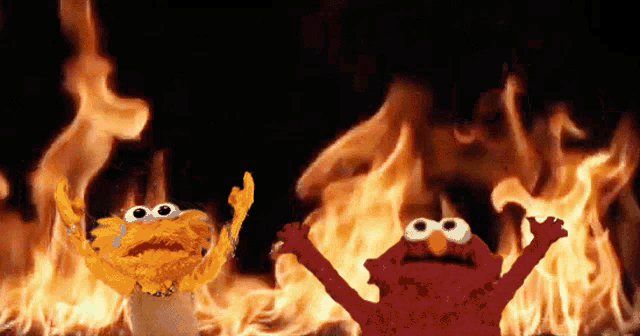 two sesame street characters elmo and garlic bread are standing in front of a fire
