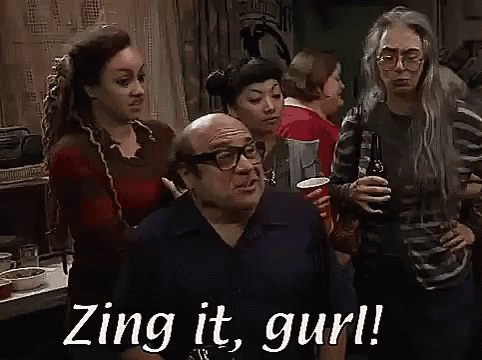 a group of people are standing in a room and a man is saying zing it , gurl .