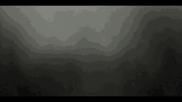 a dark gray background with a few white spots