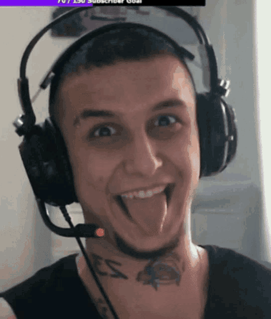 a man with a tattoo on his neck wearing headphones