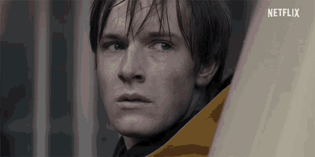 a close up of a man 's face with the word netflix on the bottom