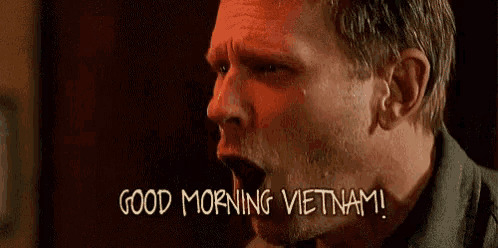 a man is screaming and saying good morning vietnam