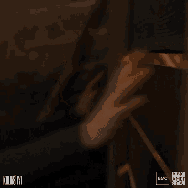 a blurred image of a woman in a dark room with the words killing eve on the bottom right