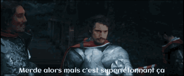 two men in armor standing next to each other with the words merde alors mais c'est super etonnant ca