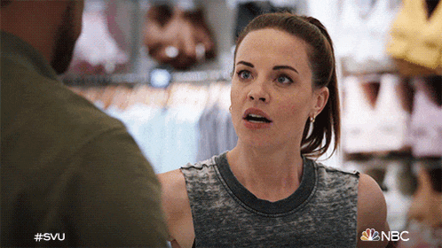 a woman is talking to a man in a store with the hashtag #svu