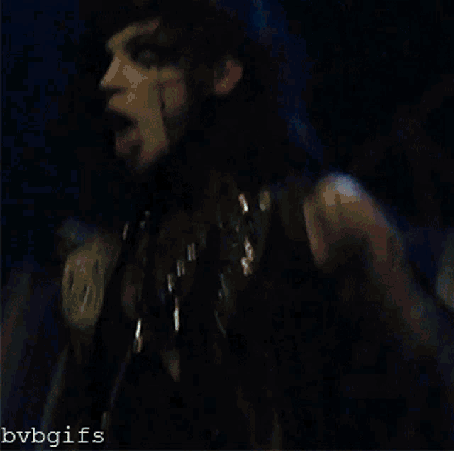 a blurry picture of a person with their tongue out and the words bvbgifs below it