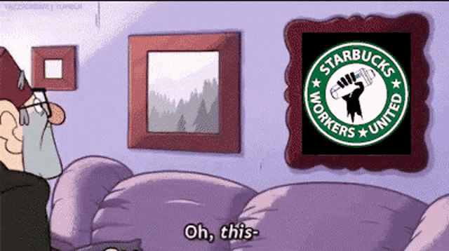 a cartoon of a man sitting on a couch looking at a starbucks workers united poster