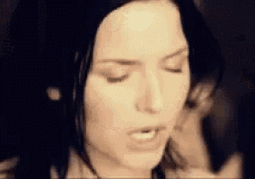 a close up of a woman 's face with her eyes closed