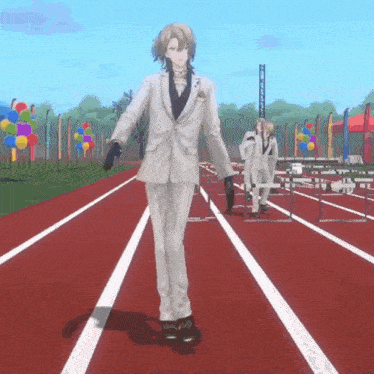 a man in a suit is walking down a track with balloons in the background