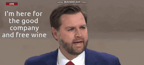 a man in a suit and tie is talking about the good company and free wine