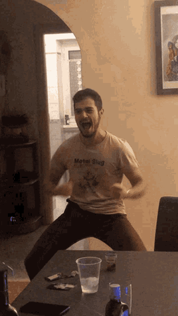 a man wearing a shirt that says " metal slug " on it