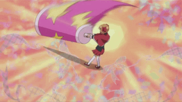 a girl in a red dress is holding a large pink object with a star on it