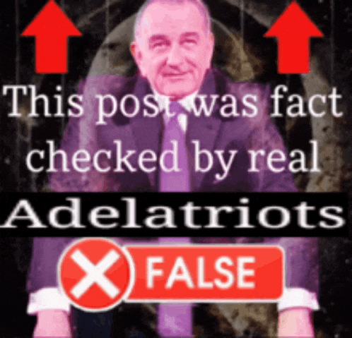 a man in a suit and tie stands in front of a sign that says this post was fact checked by real adelpatriots
