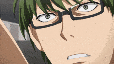 a close up of a person 's face with glasses