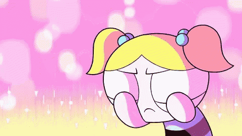 a cartoon character with a rainbow in her eyes is smiling and crying .