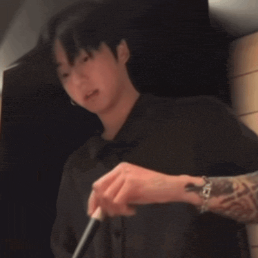 a blurry picture of a person 's face and hands