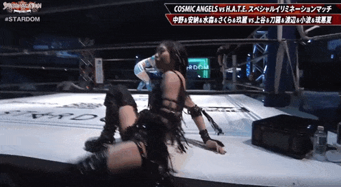 a woman is kneeling down in a wrestling ring with the word stardom on the bottom