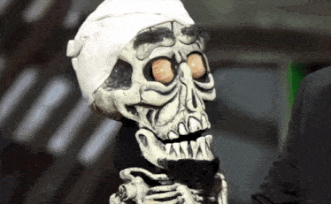 a skeleton with a bandaged head and a white headband