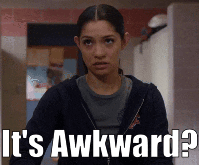 a woman says it 's awkward while wearing a black jacket