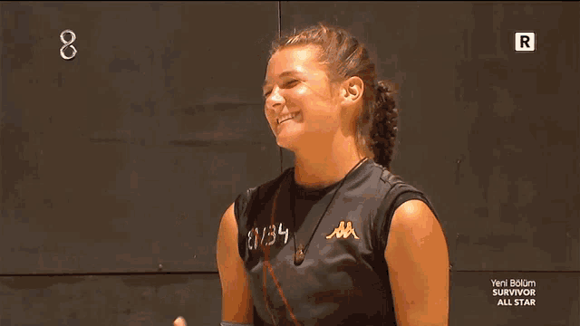 a woman wearing a black shirt that says u-34 on it