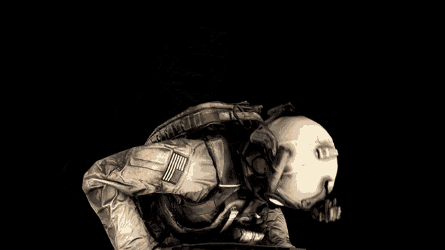 a soldier wearing a helmet and goggles with the word no on the bottom right