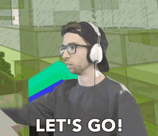 a man wearing headphones and glasses is saying let 's go
