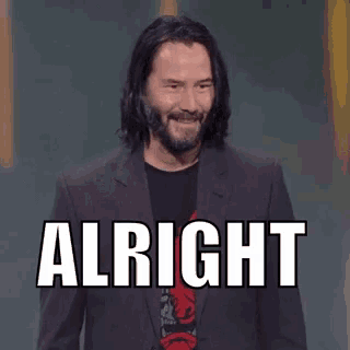 a man in a suit has the word alright above his head