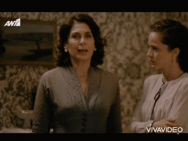two women are standing next to each other and the word vivavideo is on the screen