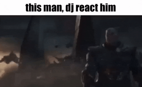 a man in a suit is standing in front of a group of people and a sign that says `` this man dj react him '' .
