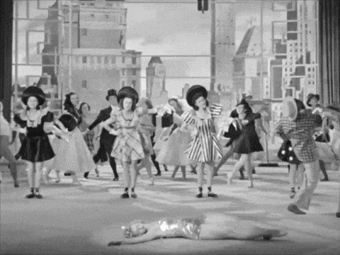a black and white photo of a group of people in costumes