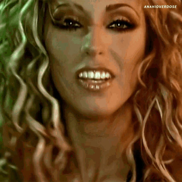 a close up of a woman 's face with anahioverdose written on the bottom right