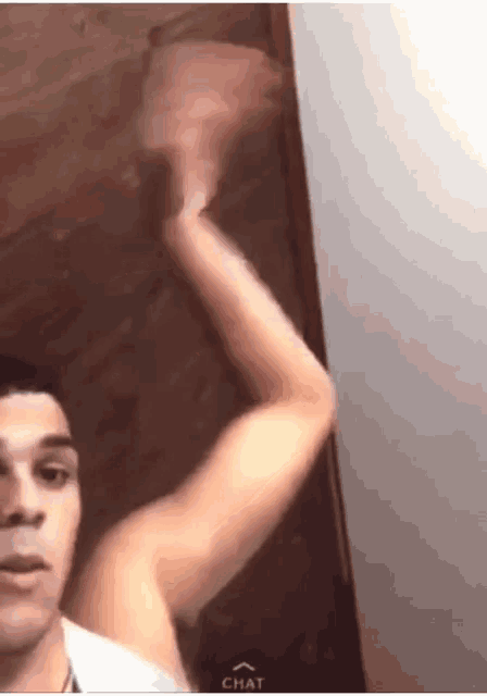 a man with a very long arm is taking a picture of himself