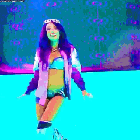 a woman in a bikini and jacket is standing in a pool of water .