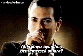 a man in a suit and tie says atilir myiz oyundan benzemezsek onlara in a foreign language