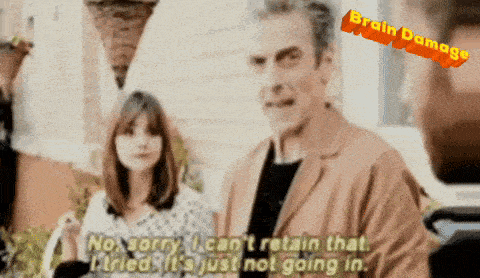 a man is talking to a woman and the words brain damage are above him