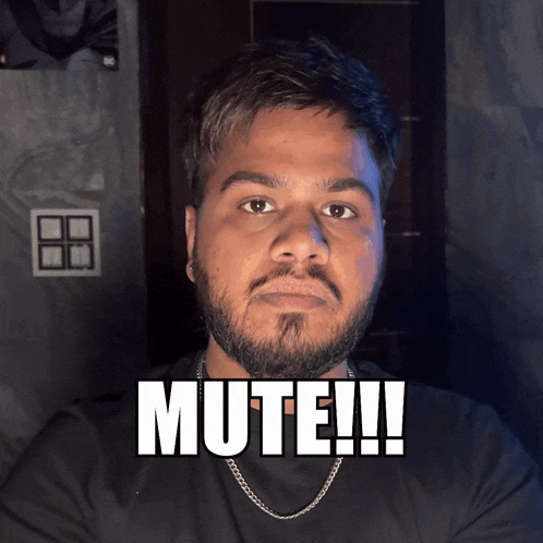 a man with a beard and a chain around his neck has the word mute on his face